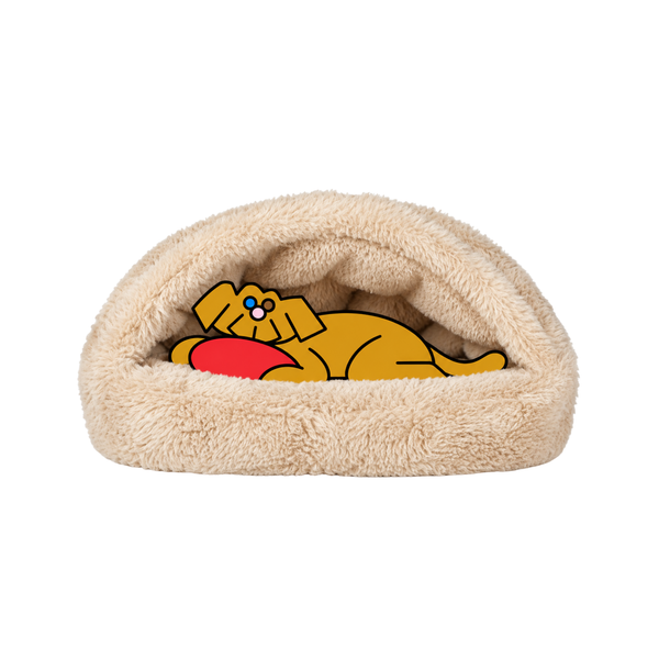 Bowsers Canopy Cozy dog bed in cream plush with the illustrated Fetch dog nestled inside beside a red frisbee.