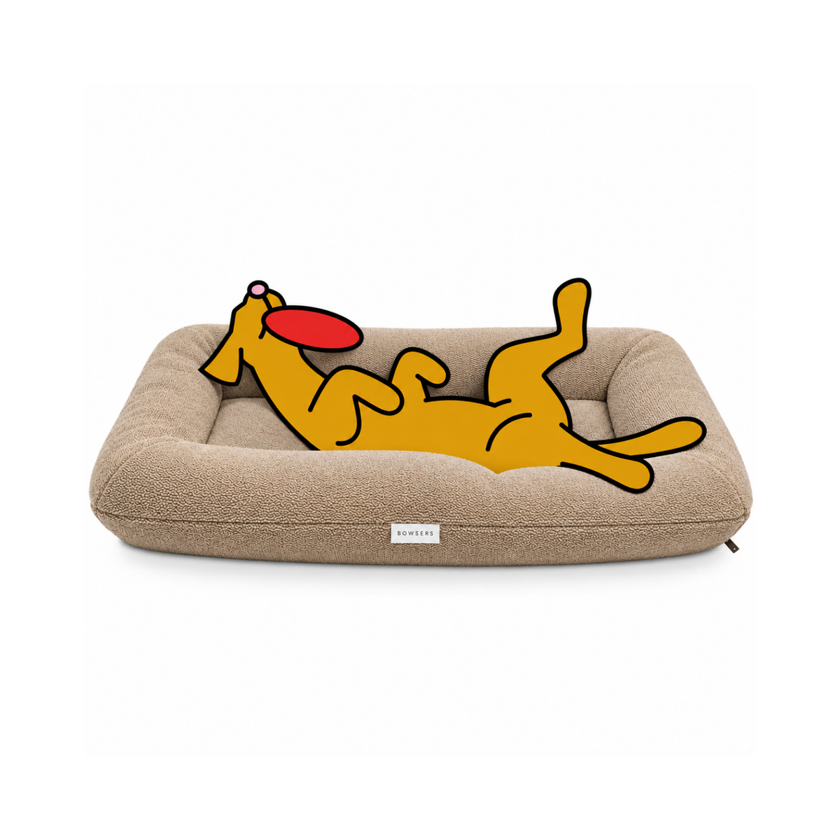 Bowsers Hugo Futon dog bed in tan with the illustrated Fetch dog lounging belly-up with a red frisbee in his mouth.
